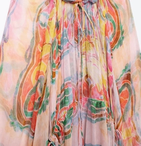 Detail of colorful abstract print midi dress with drawstring and pleated chiffon fabric
