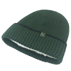 Detailed view of dark green ribbed knit beanie with thick white thermal fleece lining