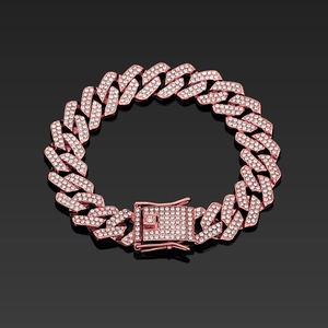Detail of rose gold 14mm rhombic Cuban link bracelet with micro-pave crystals on black background