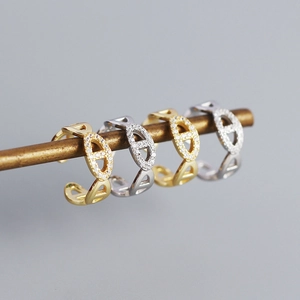 Set of 4 gold and silver pig nose ear cuffs with sparkly rhinestones on a metal rod