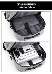 Detail showing laptop compartment with velcro strap inside grey business backpack