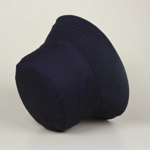 Close-up of navy blue floral bucket hat featuring detailed parallel stitching on brim