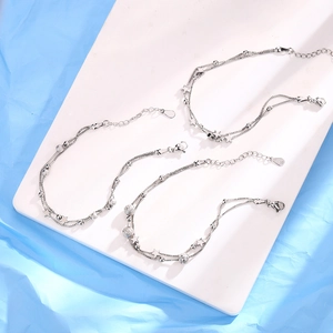 Detail showing the S925 sterling silver stamp and lobster clasp of the star bracelet