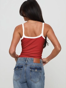 Slim fit red ribbed camisole with white lace trim and straps shown on a model back