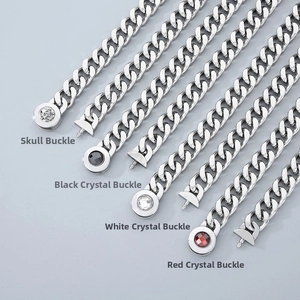 Detail of stainless steel Cuban chain clasps with skull and colored crystal inlays
