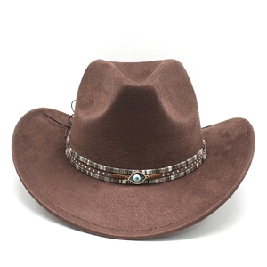 Brown Bohemian cowboy felt hat with evil eye ornament and woven strap on white background