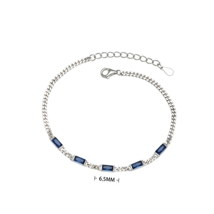Macro detail of the S925 silver chain with 6.5mm rectangular blue cubic zirconia gems