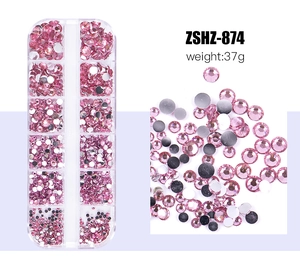 Detail of pink flatback rhinestones in a 12-slot storage box for nail art DIY