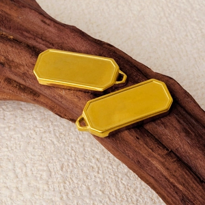 Minimalist gold 304 stainless steel rectangular pendant on wood and fabric base