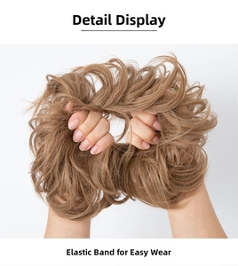 Detail of light brown messy bun hairpiece showing elastic band for easy wear and volume