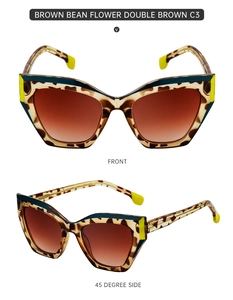 Detail view of tortoiseshell cat-eye sunglasses with brown gradient lenses and yellow tips