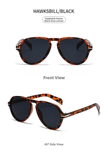 Detail view of vintage aviator sunglasses in tortoise shell frame with dark grey lenses