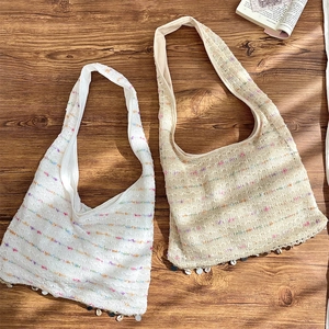 Detailed knit texture and color stripes on large capacity handmade crochet tote bags