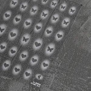 Macro detail of to 2214 matte dark grey hollow butterfly and heart nail art sticker