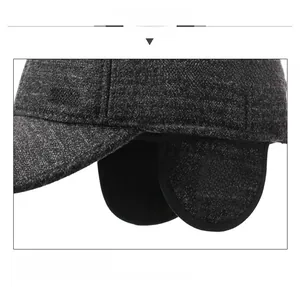 Detailed view of grey wool blend winter baseball cap with protective ear flaps and lining