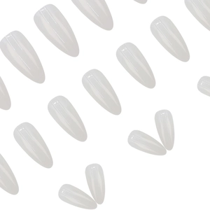 Elegant moonlight white translucent stiletto press-on nails in a minimalist arrangement