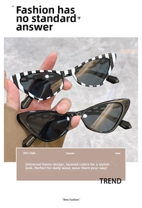 Detail view of stylish striped and solid black cat-eye sunglasses with thick retro frames