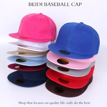 Multiple colors of hip hop baseball caps stacked neatly in two rows for outdoor style