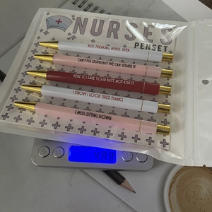Nurse penset weight measurement on digital scale with humorous quotes and packaging