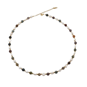 Colorful gemstone and freshwater pearl beaded necklace with gold accents on white background
