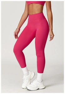 Close-up of high-waisted magenta yoga leggings with a flattering push-up fit
