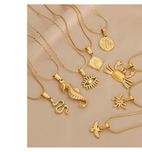 Detailed arrangement of gold animal charms and pendants on soft silk background