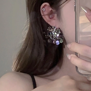Vintage floral crystal earrings with silver needles and geometric metallic flower design