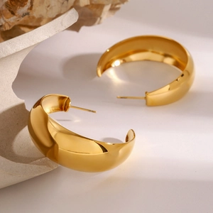 Minimalist chunky C-shaped golden hoop earrings with polished stainless steel finish