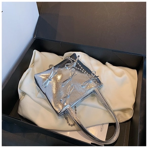 Silver mini handbag with bow details and chain strap in a premium black gift box