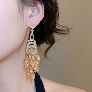 Elegante Ohrstecker mit champagnerfarbenen Kristallen und Rautenfransen im Vintage-Hofstil