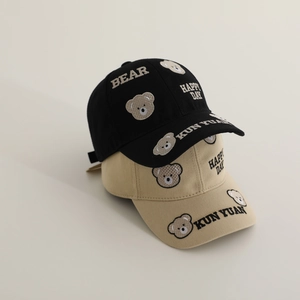 Close-up of bear embroidery and premium cotton fabric on these children baseball caps