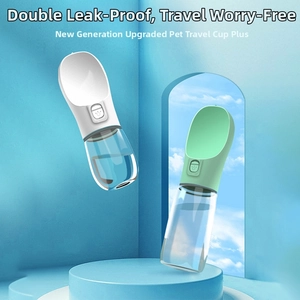 Close-up of portable pet water bottle with wide bowl and leak-proof button for outdoor use