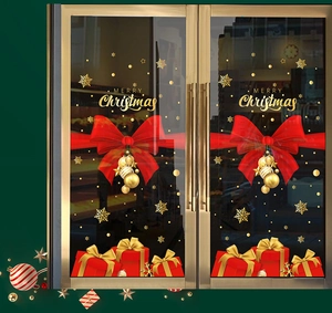 Detailed Christmas window decals featuring red bows, gold bells, and snowflakes ornaments