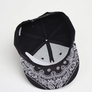 Hip hop snapback hat featuring paisley print brim and embroidered star patterns