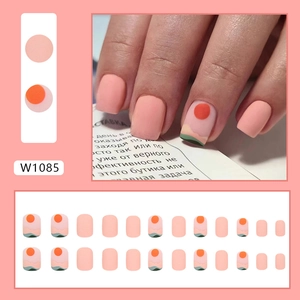 Short square peach press-on nails featuring sunset mountain art and matte finish