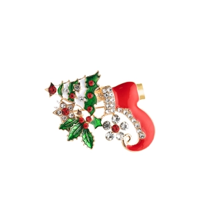 Macro detail of Christmas stocking brooch with red enamel and sparkling rhinestones