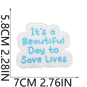 Detailed view of cloud embroidery patch with Save Lives quote and dimension markings