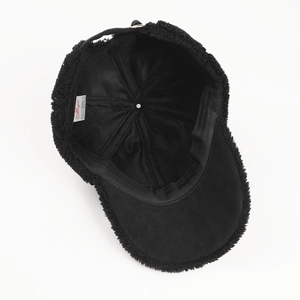 Close-up of black fleece baseball cap interior showing mesh lining and wash label