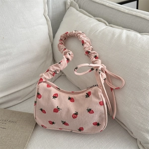 Pink corduroy strawberry print underarm bag with ruffled handle and bow detail