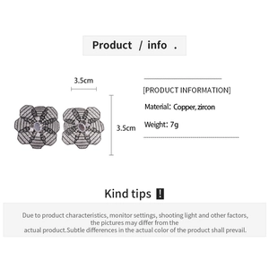 Detailed view of hollow mesh flower earrings with copper zircon and lacy texture