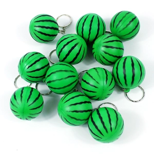 Detailed view of eleven green mini watermelon pendants with metal keychain rings