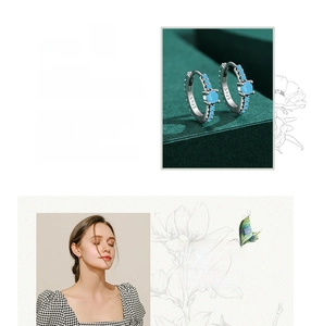 Detail of s925 silver hoop earrings with blue turquoise stones and model try-on view