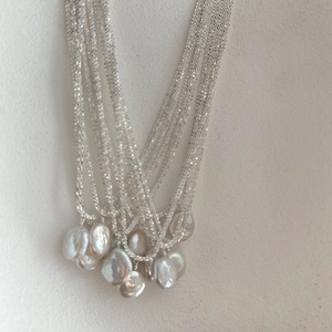 S925 sterling silver multilayer pearl necklace with baroque pearls on ceramic plate