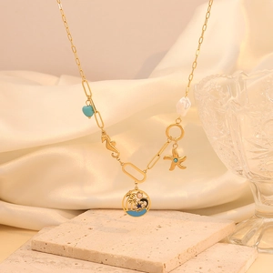 Detail of bohemian gold layered necklace with seahorse, starfish, and shell pendants