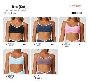Sportbeha met contrastbies en cross-waist shorts in zwart blauw roze paars