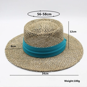 Detail view of woven straw hat with dimensions and cyan ribbon on white background