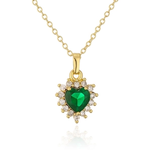 Detail of 18K gold necklace featuring a heart-shaped emerald green gemstone with halo diamonds