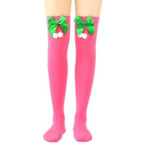 Pink over-the-knee socks with green satin bows and white fuzzy pom-poms for holidays