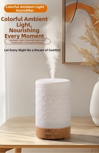 Detail of crackle glaze mini humidifier with wood grain base and warm LED light effect