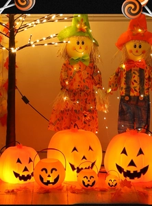 Halloween decor set featuring glowing LED pumpkin lanterns and festive scarecrow dolls